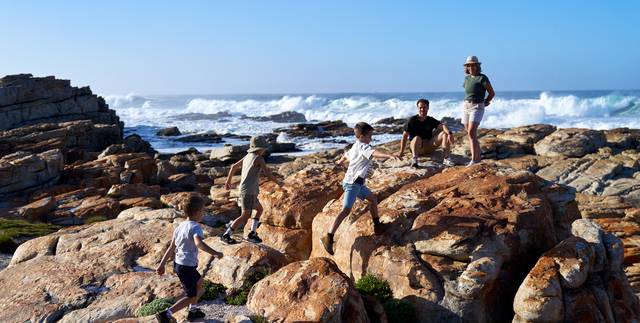 Family-playing-on-rocks-at-cape-st-francis-resort-beach Family-playing-on-rocks-at-cape-st-francis-resort-beach